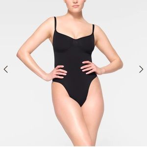 Skims seamless sculpt thong bodysuit. Size S/M. Worn only to try on.